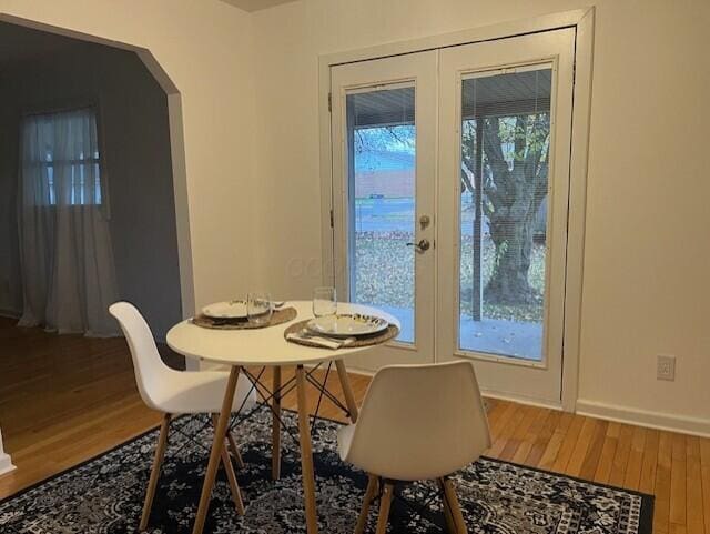 dining area featuring french doors and hardwood / wood-style flooring