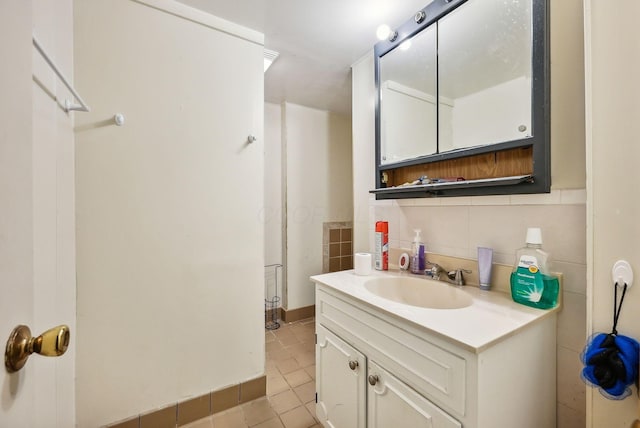 bathroom with vanity, backsplash, and tile patterned flooring