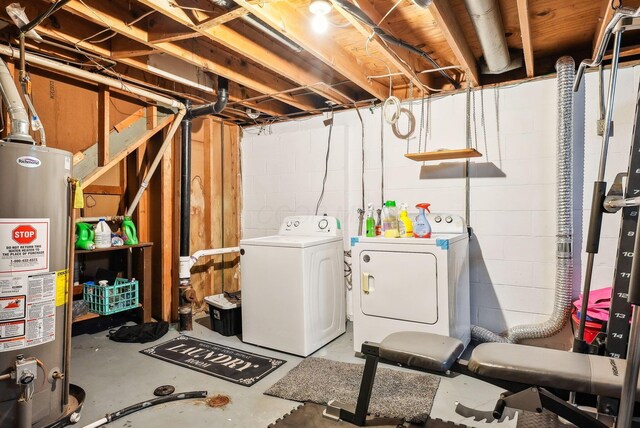 basement featuring independent washer and dryer and water heater