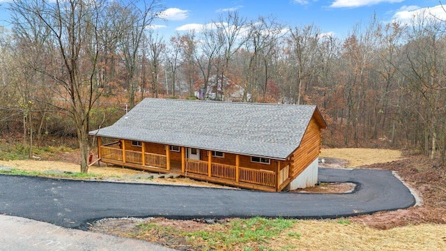 316 Ridgewood Blvd, Belpre, OH 45714 - view of front of property featuring a porch, a wooded view, and a shingled roof