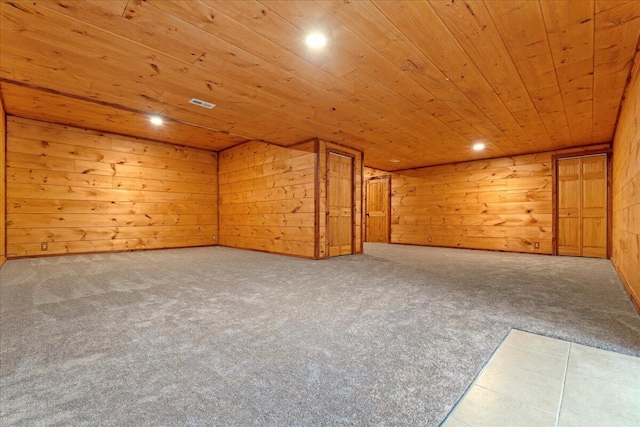 bonus room featuring wooden walls, carpet, and wood ceiling