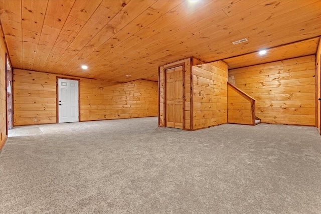 additional living space featuring wooden ceiling, carpet floors, and wooden walls