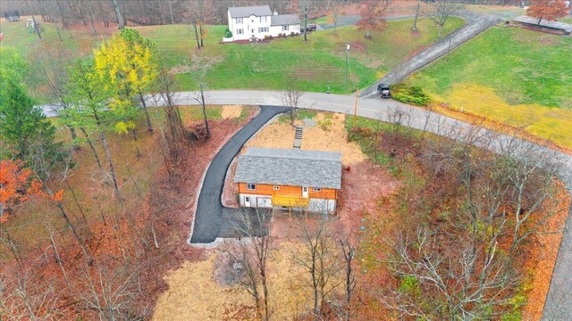 birds eye view of property with a rural view