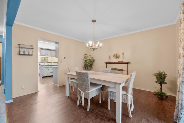 dining space with a chandelier, dark hardwood / wood-style floors, and crown molding