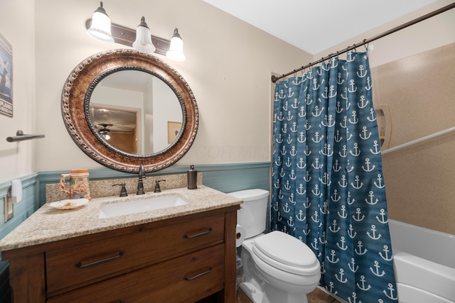 full bathroom featuring vanity, toilet, and shower / tub combo with curtain