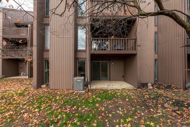 back of house with a patio area and central AC unit