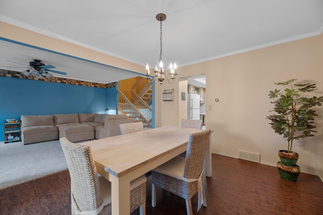 dining area with ceiling fan with notable chandelier, dark hardwood / wood-style floors, and crown molding