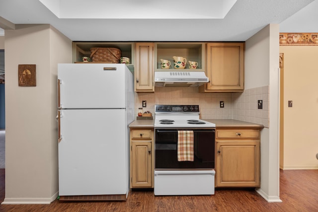 kitchen with decorative backsplash, white appliances, and hardwood / wood-style flooring