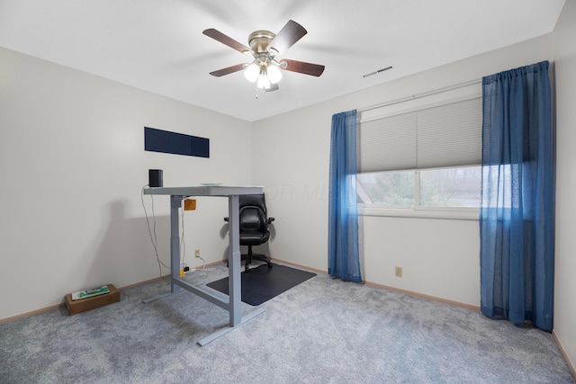 workout area featuring carpet flooring and ceiling fan