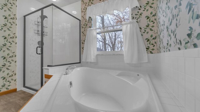 bathroom featuring separate shower and tub and tile patterned floors