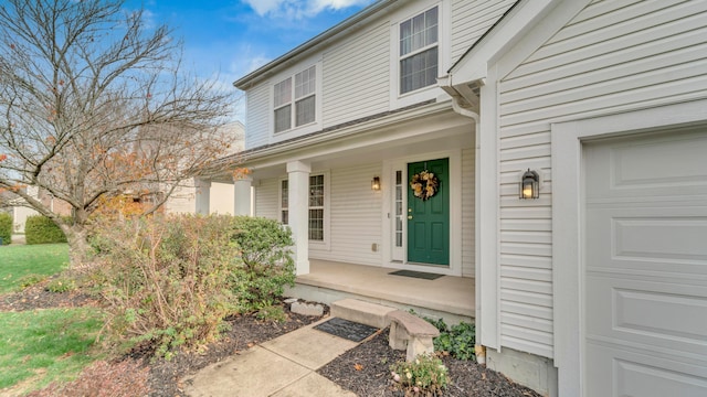 view of exterior entry with covered porch