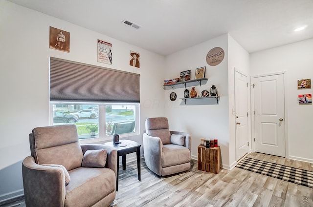 sitting room featuring light wood-type flooring