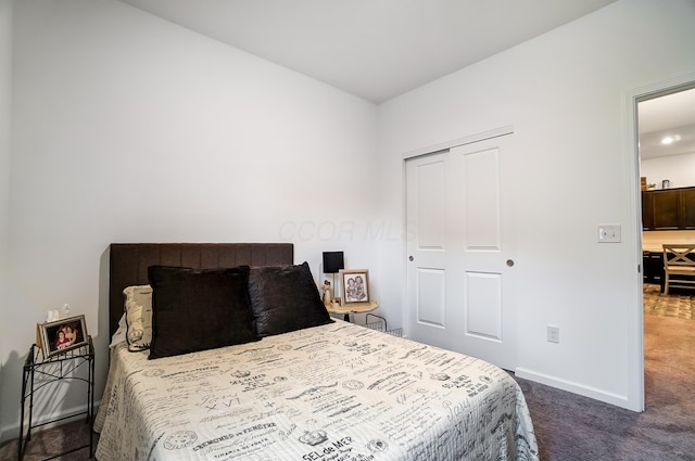 carpeted bedroom with a closet