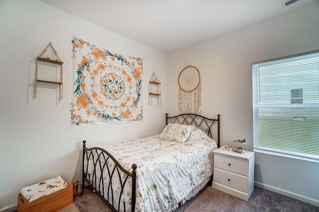 bedroom with dark carpet