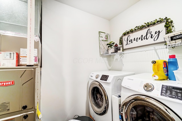 laundry room with independent washer and dryer