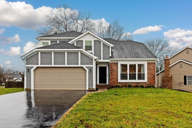 view of front facade with a front yard and a garage