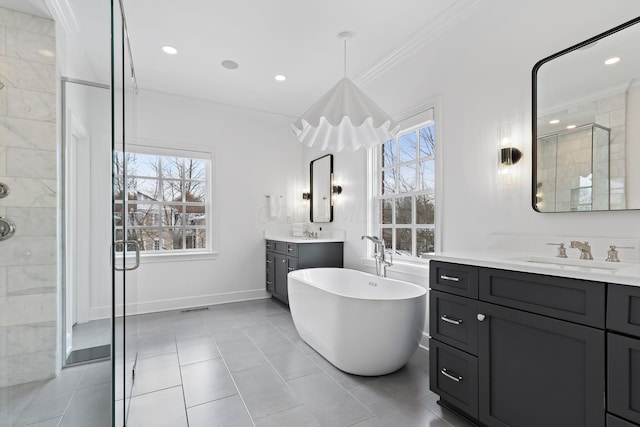 bathroom featuring crown molding, separate shower and tub, a wealth of natural light, and vanity