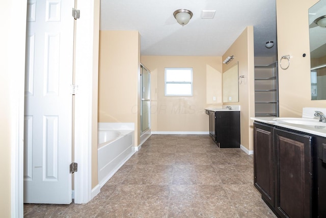 bathroom with plus walk in shower and vanity