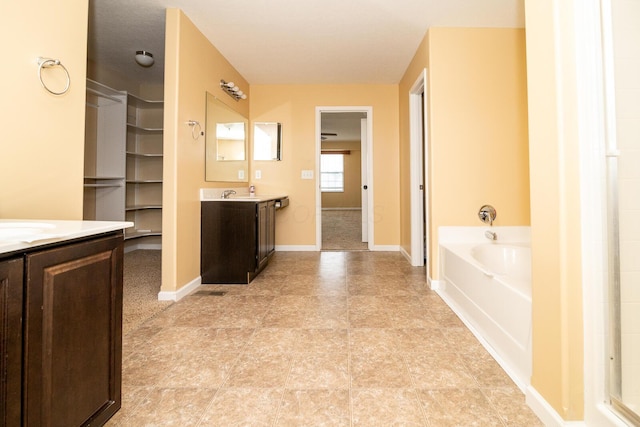 bathroom with vanity and a bathing tub