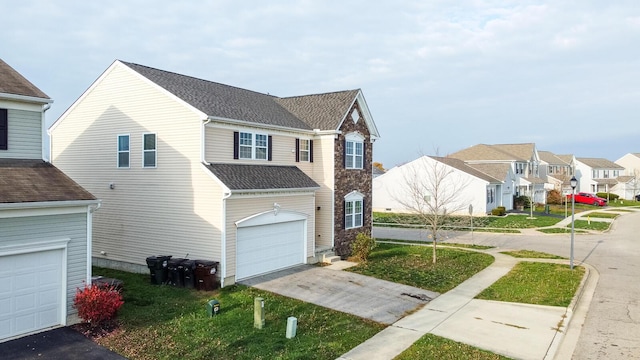 view of front facade with a garage and a front yard