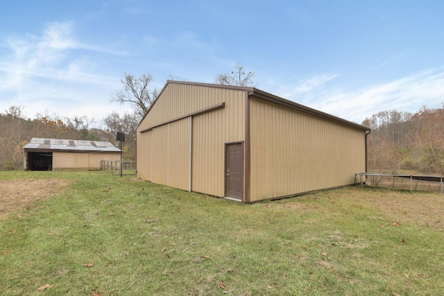 view of outdoor structure with a yard