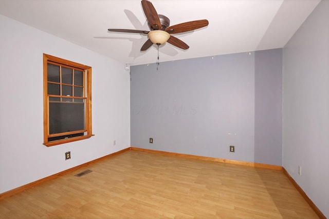 unfurnished room featuring light hardwood / wood-style flooring and ceiling fan