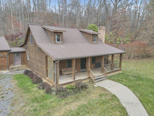 view of front of home with a front lawn and covered porch