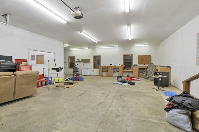 garage featuring a garage door opener and electric panel