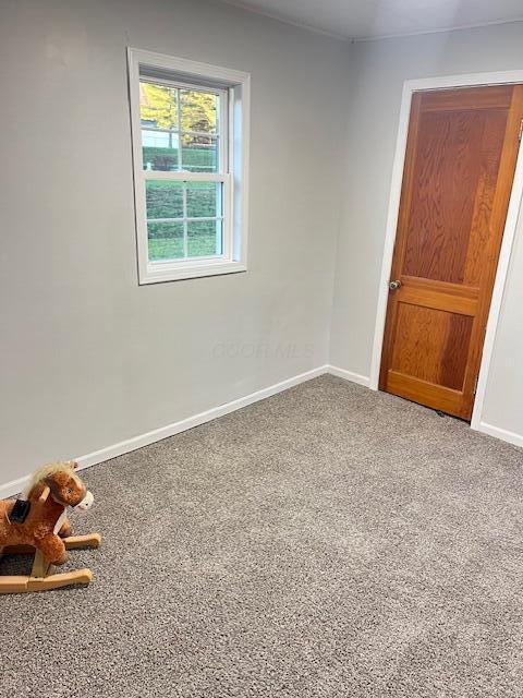 spare room with carpet flooring