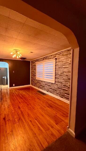 unfurnished room with hardwood / wood-style floors