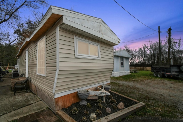 view of property exterior at dusk