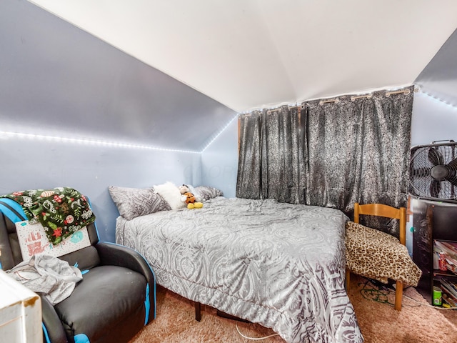 bedroom with carpet and lofted ceiling