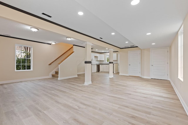 unfurnished living room with light hardwood / wood-style flooring