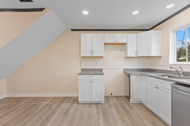 kitchen with decorative backsplash, dishwasher, white cabinets, and light wood-type flooring