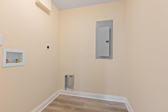 laundry area featuring washer hookup, electric dryer hookup, electric panel, and light hardwood / wood-style flooring