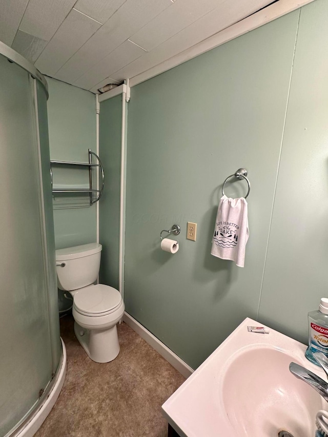 bathroom featuring walk in shower, vanity, and toilet