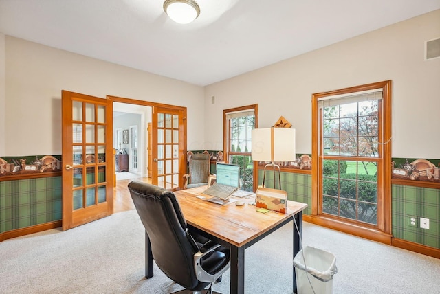 office space with light carpet, french doors, and a wealth of natural light