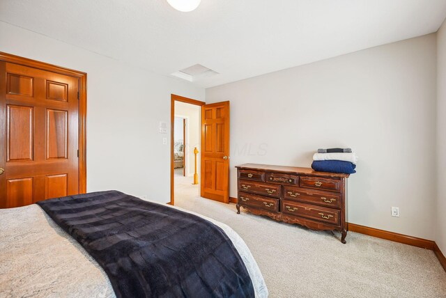 bedroom with light colored carpet