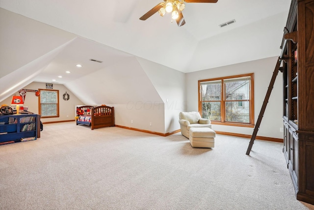 bedroom featuring ceiling fan, light carpet, and vaulted ceiling