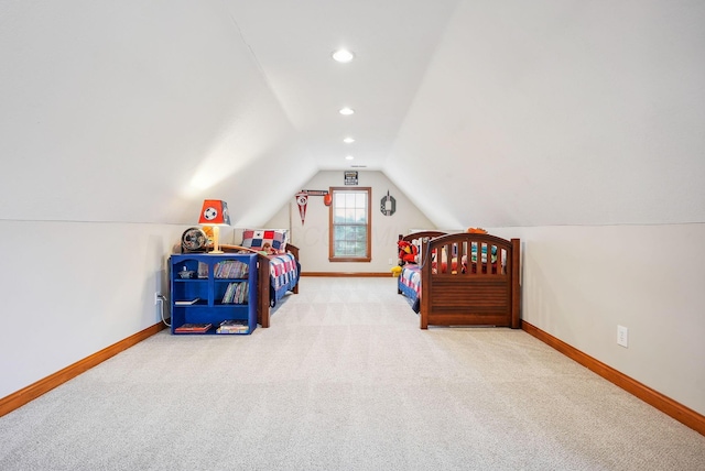 bedroom with carpet flooring and lofted ceiling