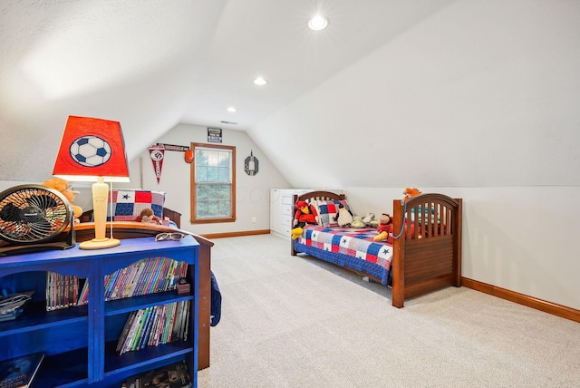 bedroom featuring light colored carpet and vaulted ceiling