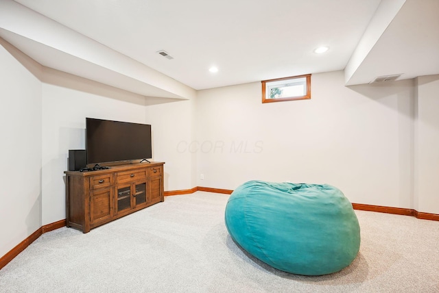 living area with light carpet