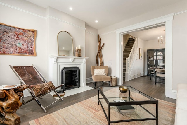 living area with a chandelier and dark hardwood / wood-style floors