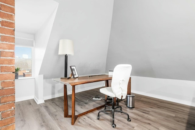 office area with light hardwood / wood-style floors