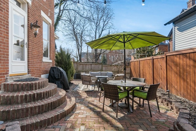 view of patio / terrace with an outdoor hangout area and grilling area