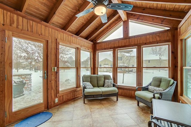 sunroom / solarium with vaulted ceiling with beams, ceiling fan, and a wealth of natural light