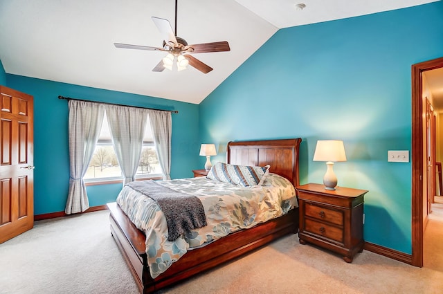 bedroom featuring ceiling fan, light colored carpet, and lofted ceiling