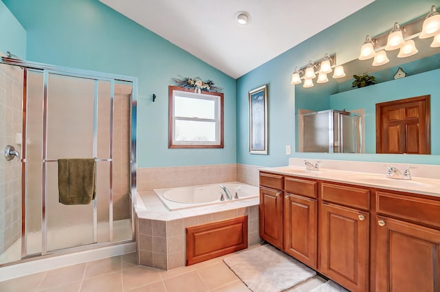 bathroom with plus walk in shower, tile patterned floors, vanity, and vaulted ceiling