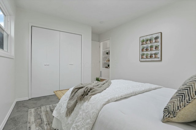 carpeted bedroom with a closet