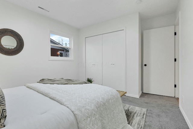 carpeted bedroom featuring a closet